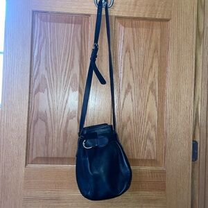 Black, over-the-shoulder, Coach purse; leather; adjustable shoulder strap
